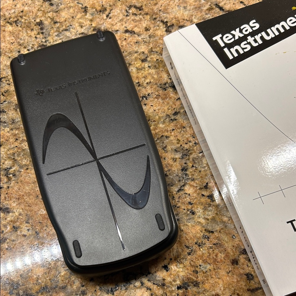 EUC Texas Instruments TI-83 Plus Graphing calculator with instruction book